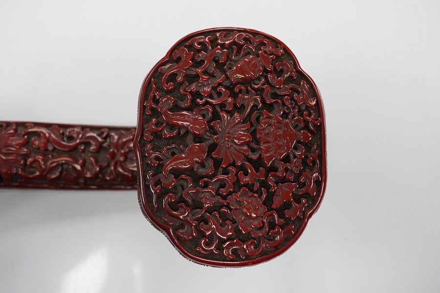 A Chinese red lacquered Ruyi sceptre, 41cm. Condition - fair to good